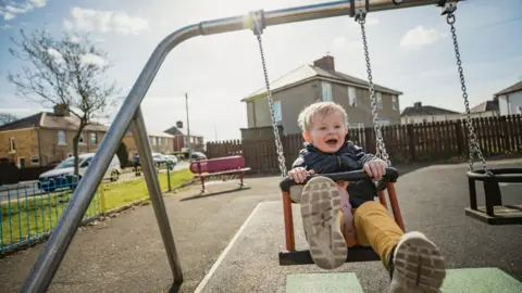 Getty Images Child on a swing