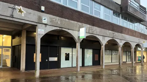 Building boarded up in town centre