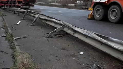 Stamford A1 crash Lorry driver injured in central reservation