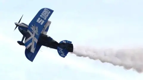 BBC Blue and white Pitts biplane