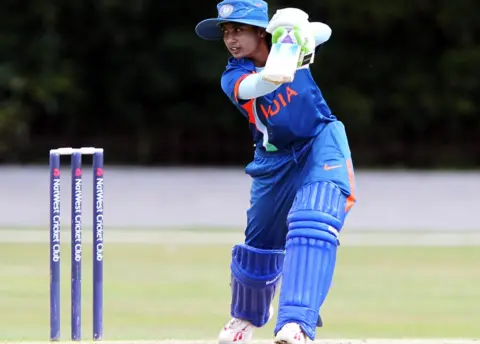 Getty Images Indian women's team captain Mithali Raj is a top player, but earns much less than her male counterpart Virat Kohli