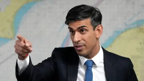 PA Media Rishi Sunak pictured at a Home Office facility in Dover last month