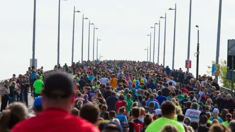 Mike Daish Marathon runners on bridge