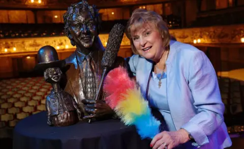 The Grand Theatre Lady Anne Dodd with sculpture of Sir Ken Dodd