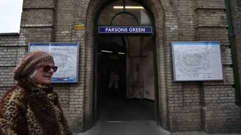 AFP Woman walks past Parsons Green Tube station