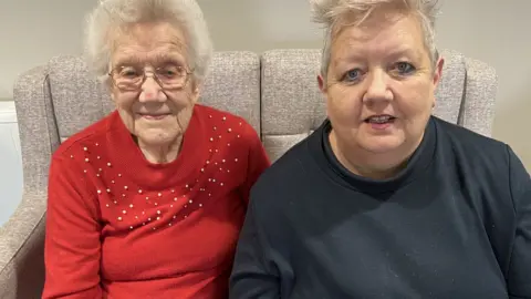 Muriel and Diane on the sofa in Pembroke House