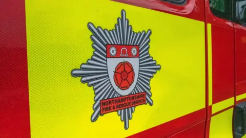 Northamptonshire Fire and Rescue Service Fire engine with Northamptonshire Fire and Rescue Service logo