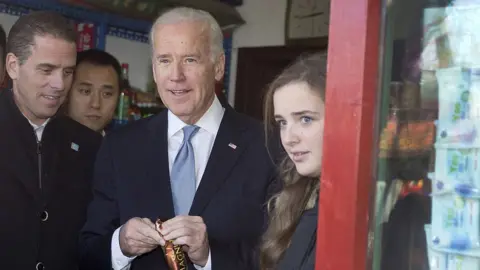 Getty Images Hunter, Joe and Finnegan Biden in China in 2013