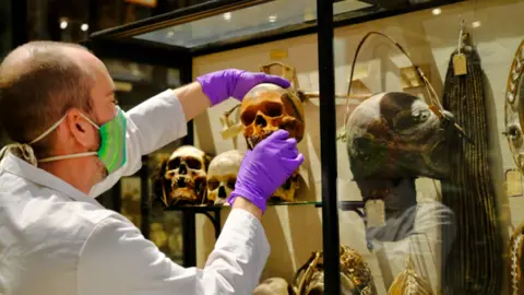 Pitt Rivers Museum, University of Oxford  Skull being removed