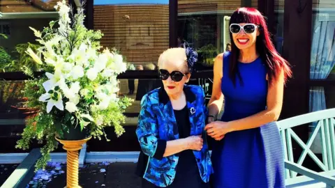 Martina Ferguson Martina Ferguson taking her mum to a tea party before the pandemic