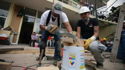 BBC Carpenters construct support beams that could help stabilise the collapsed Enrique Rébsamen school, Mexico City, 20 September 2017