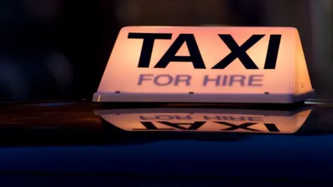 Getty Images Taxi sign