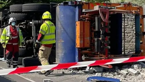 upturned bin lorry