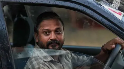 Mammootty Kampany Sudhi Kozhikode seen driving a car in the film