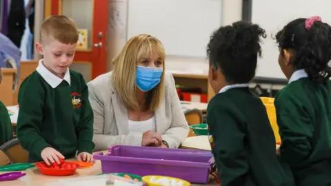 PA Media The education minister Michelle McIlveen visiting a school in September
