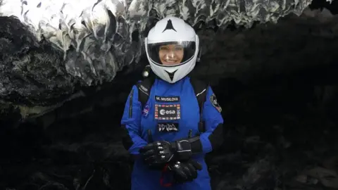 Michaela Musilova M.Musilova exploring a lava tube while outside the simulated spacecraft