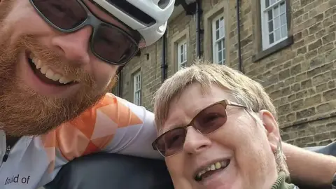 PA Media Anthony Butcher with his mum