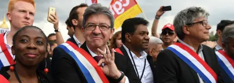 Getty Images Jean-Luc Mélenchon (2nd L) during a protest in June 2017