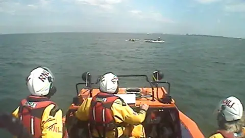 Hoylake RNLI Paddle boarders being rescued by Hoylake RNLI volunteers