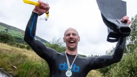 A photo of five-time World Champion bog snorkeller Neil Rutter