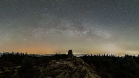 Ben Bush Stars pictured in the night sky over Grizedale Forest in Ambleside