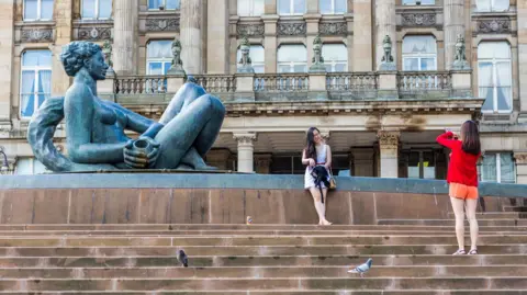 Getty Tourists in Birmingham's Victoria Square