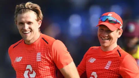 England players David Willey and Eoin Morgan celebrate