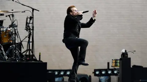 Reuters Bono on stage in Twickenham