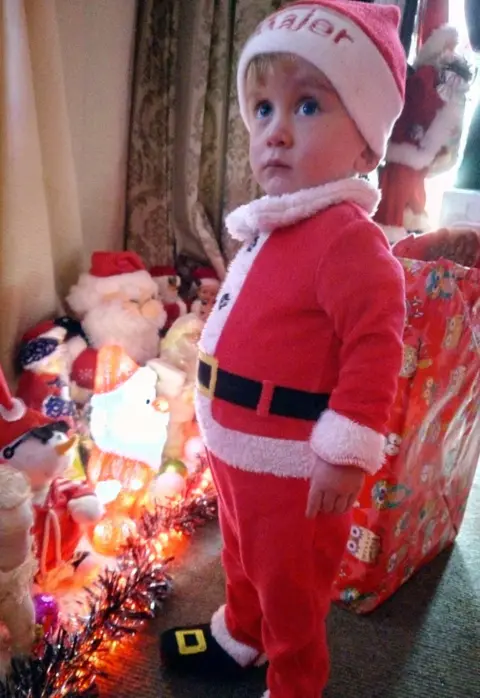 Danell Cook Sonny Lee as Santa