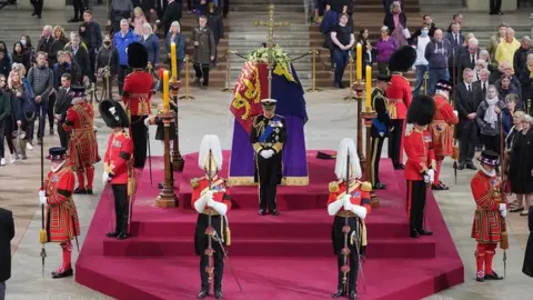 PA Media King Charles III and his siblings stand vigil in Westminster Hall