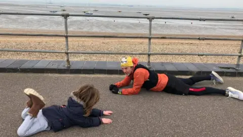 Natalie Fernando Ian Shelley on the ground with Rudy Fernando
