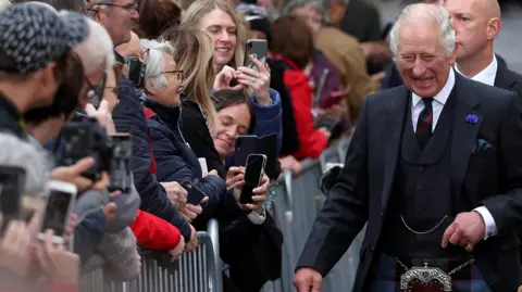 Crowds gathered in Dunfermline to welcome King Charles and the Queen Consort.