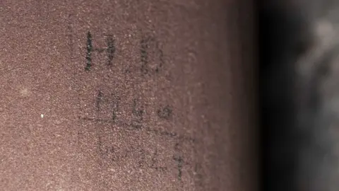 Antonia Thomas Pencil inscription on a pillar