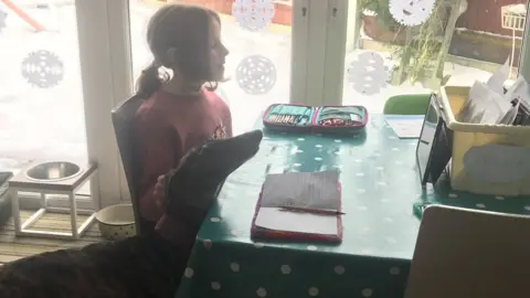 Family Photo Mollie doing her school work