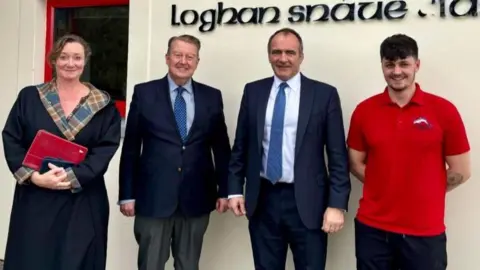 Southern Swimming Pool Education Minister Daphne Caine, Chief Minister Alfred Cannan, the DESC Minister Daphne Caine, Board Chairman and Laurence Vaughan-Williams