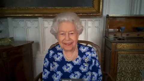 Buckingham Palace The Queen speaking to volunteers on a Zoom call