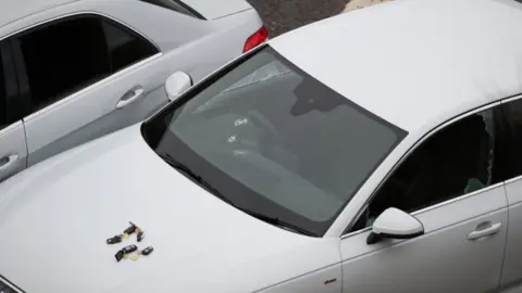 Peter Byrne/PA Wire Audi with bullet holes