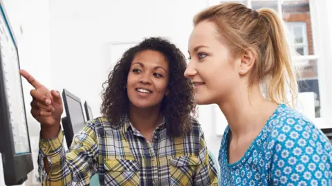 Businesswoman giving computer training