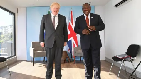 PA Media Prime Minister Boris Johnson with South African President Cyril Ramaphosa