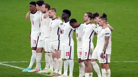 PA Media England's football team after the penalties