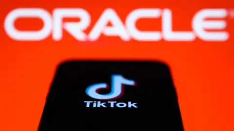 Getty Images TikTok on mobile screen in front of Oracle logo