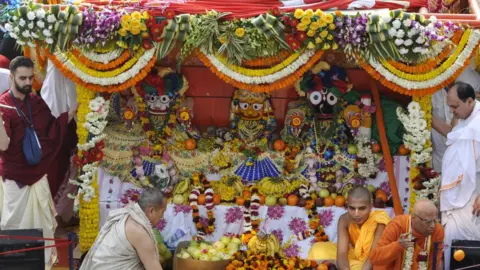 Getty Images Devotees pull a chariot of Lord Jagannath, his brother Balabhadra and sister Subhadra during the Jagannath Rath Yatra, on February 17, 2019 in Noida, India.