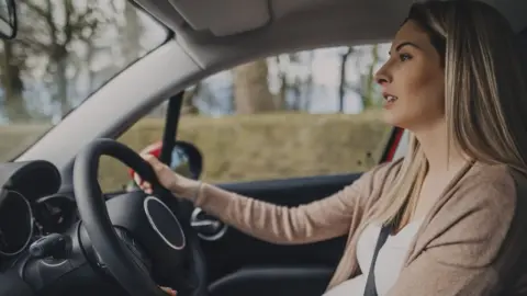 Getty Images Woman driving