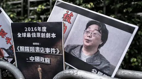 Getty Images Mr Gui Minhai on a placard