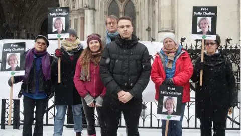 PA David Challen (centre) with members of Justice for Women protesting outside the Royal Courts of Justice