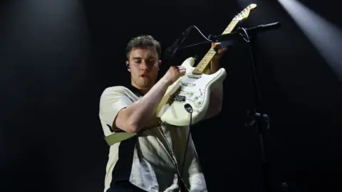 Getty Images Sam fender playing the guitar