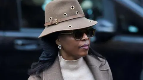 Nigeria's former Petroleum Minister Diezani Alison-Madueke arrives at Southwark Crown Court - wearing a hat and sunglasses