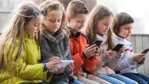 Getty Images Children on devices