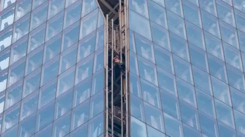 Lucas Cannon Man climbing The Shard in London