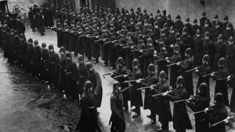 Hulton ArchiveGetty Images The Royal Irish Constabulary under inspection in 1913